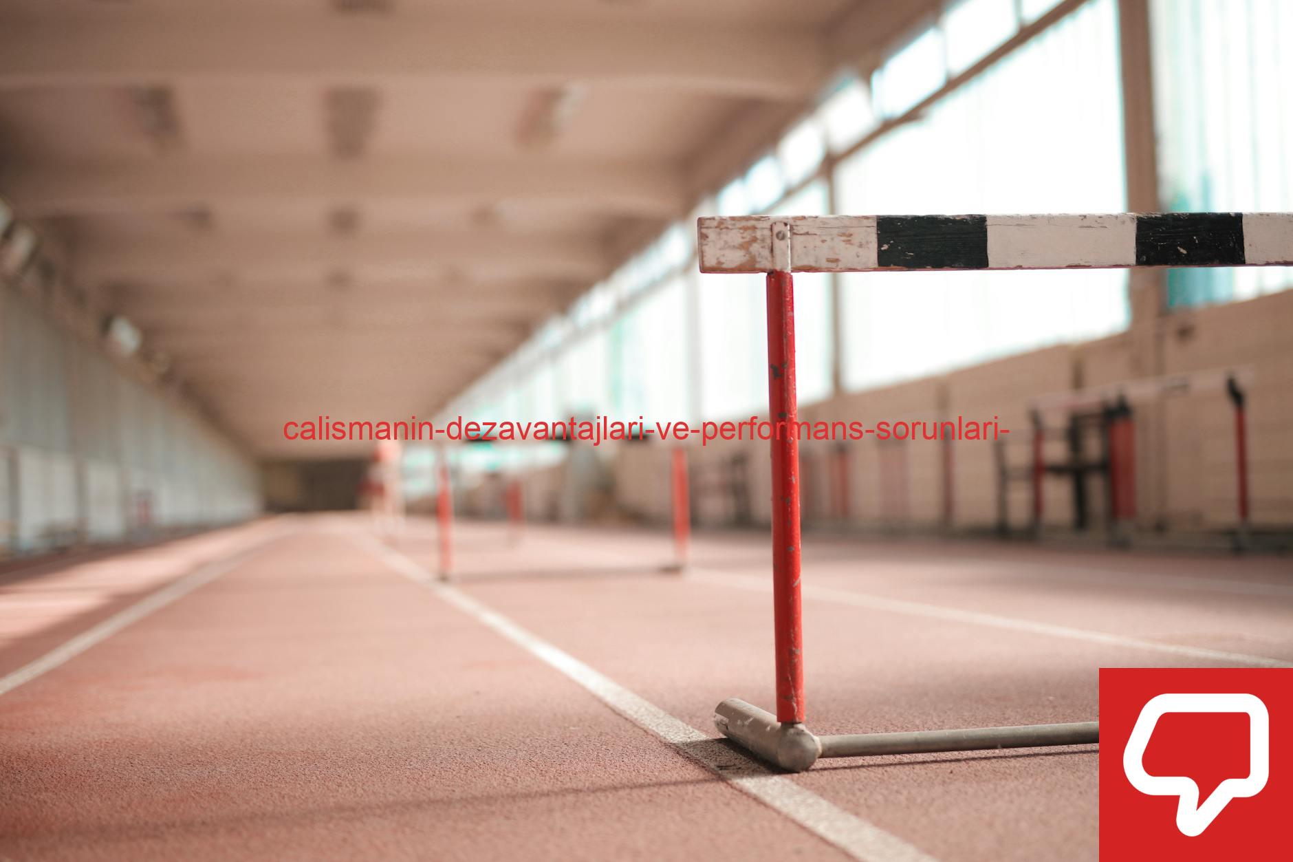 Hurdle painted in white black and red colors placed on empty rubber running track in soft focus