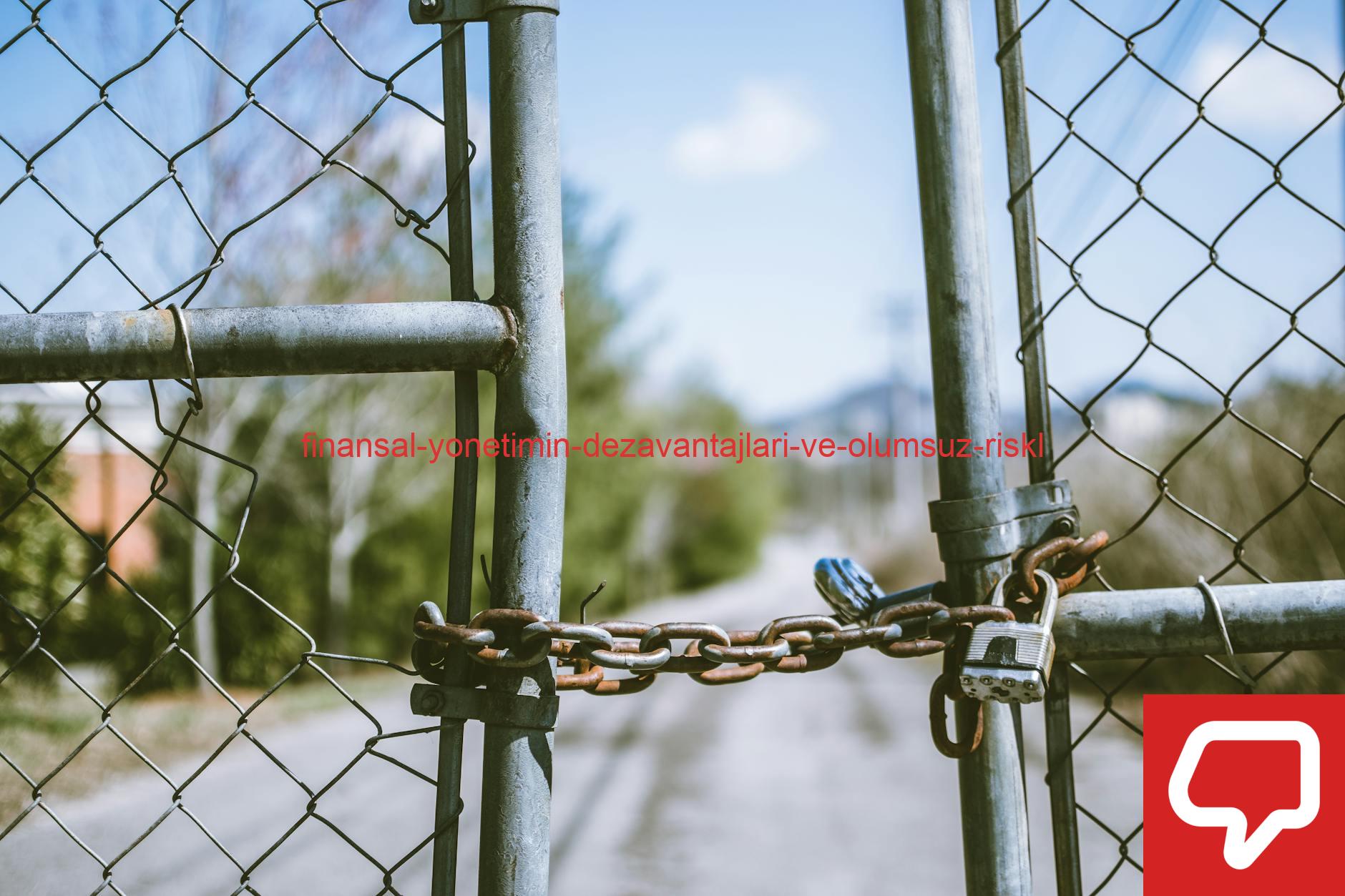 Close-up of a locked chain link fence with rusty chains and padlock, outdoors, in bright daylight.