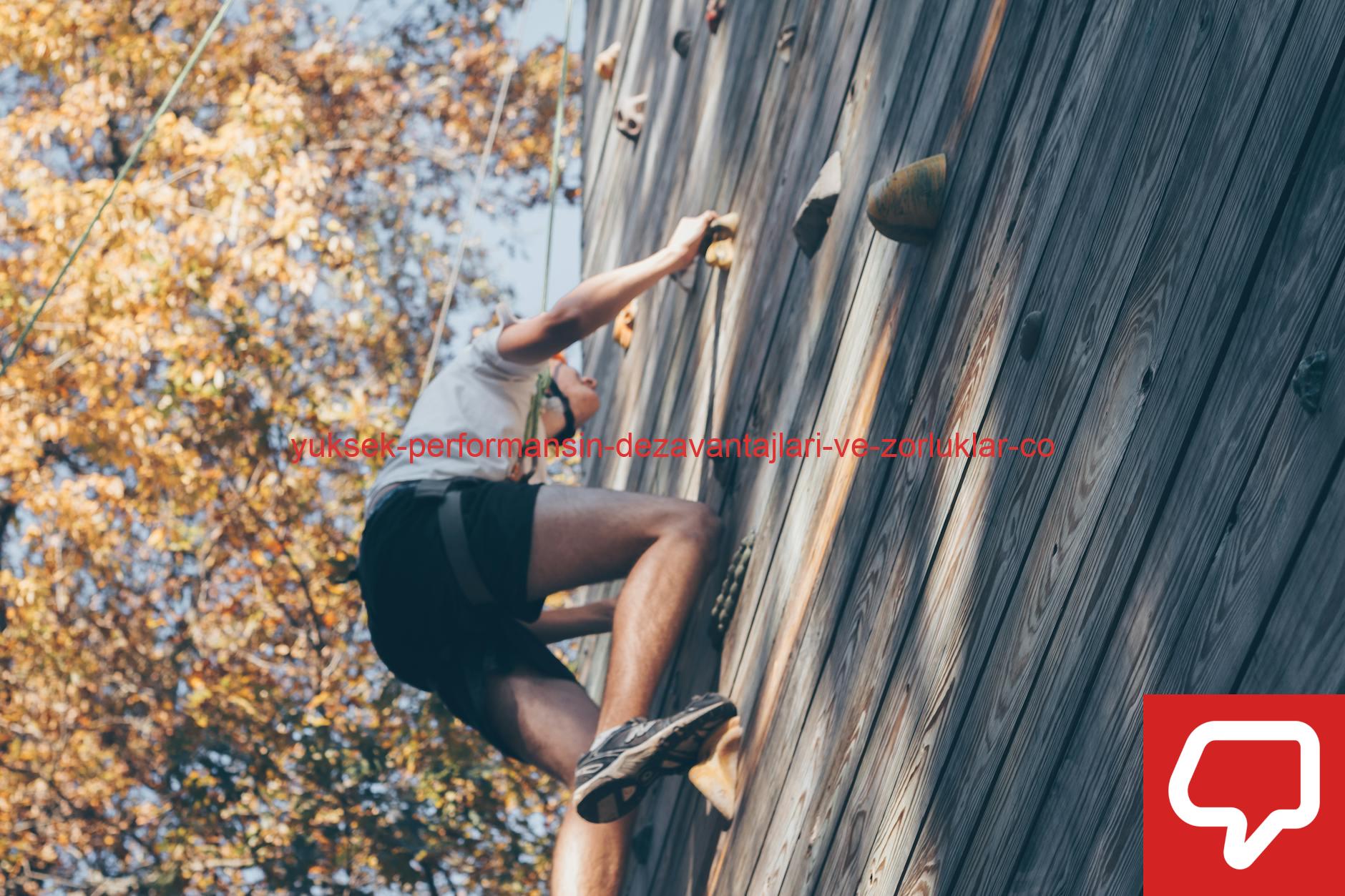 A person enjoying a thrilling wall climbing experience outdoors with fall foliage.