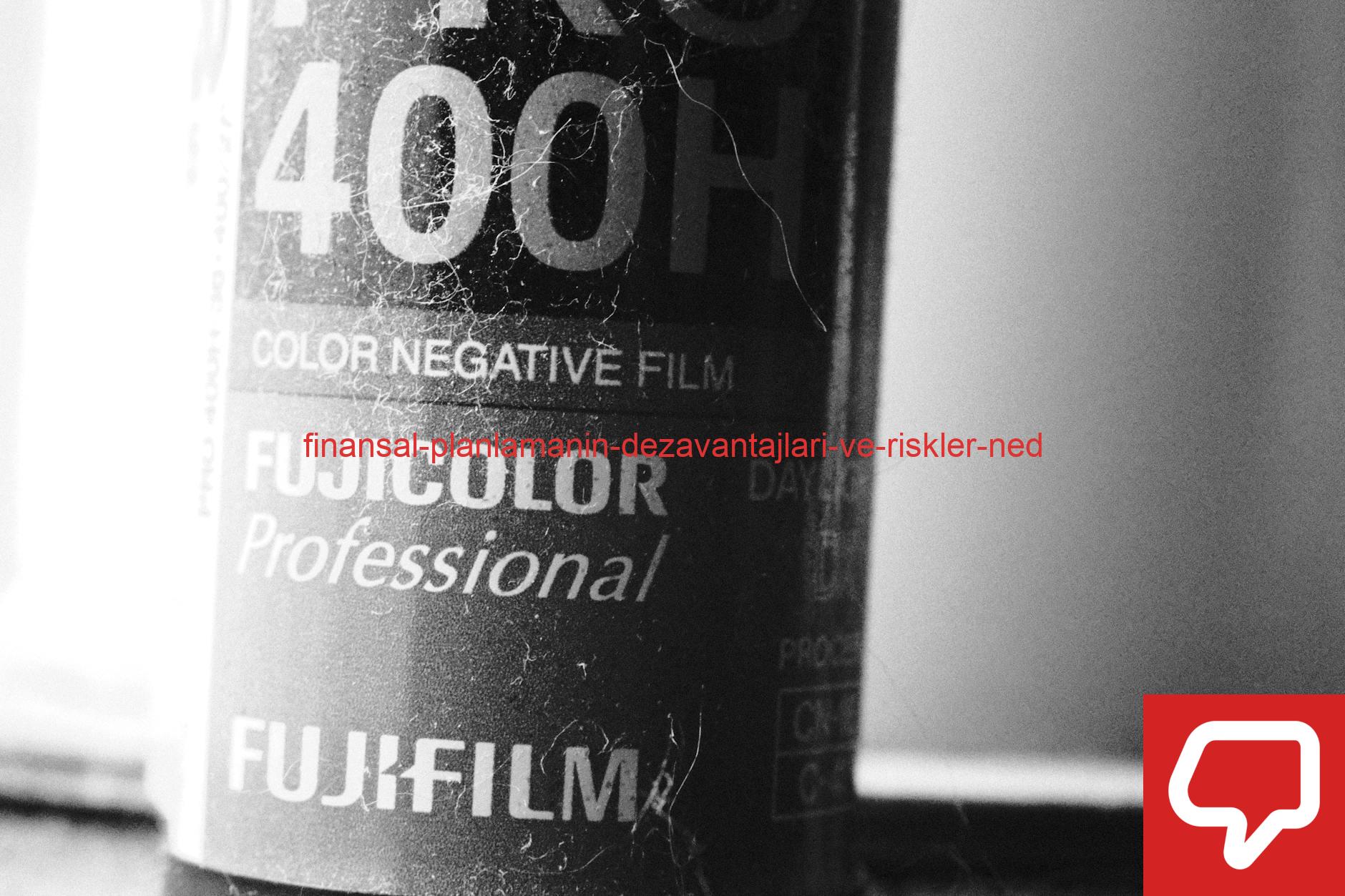 Monochrome close-up of a Fujicolor Pro 400H film roll, emphasizing texture.